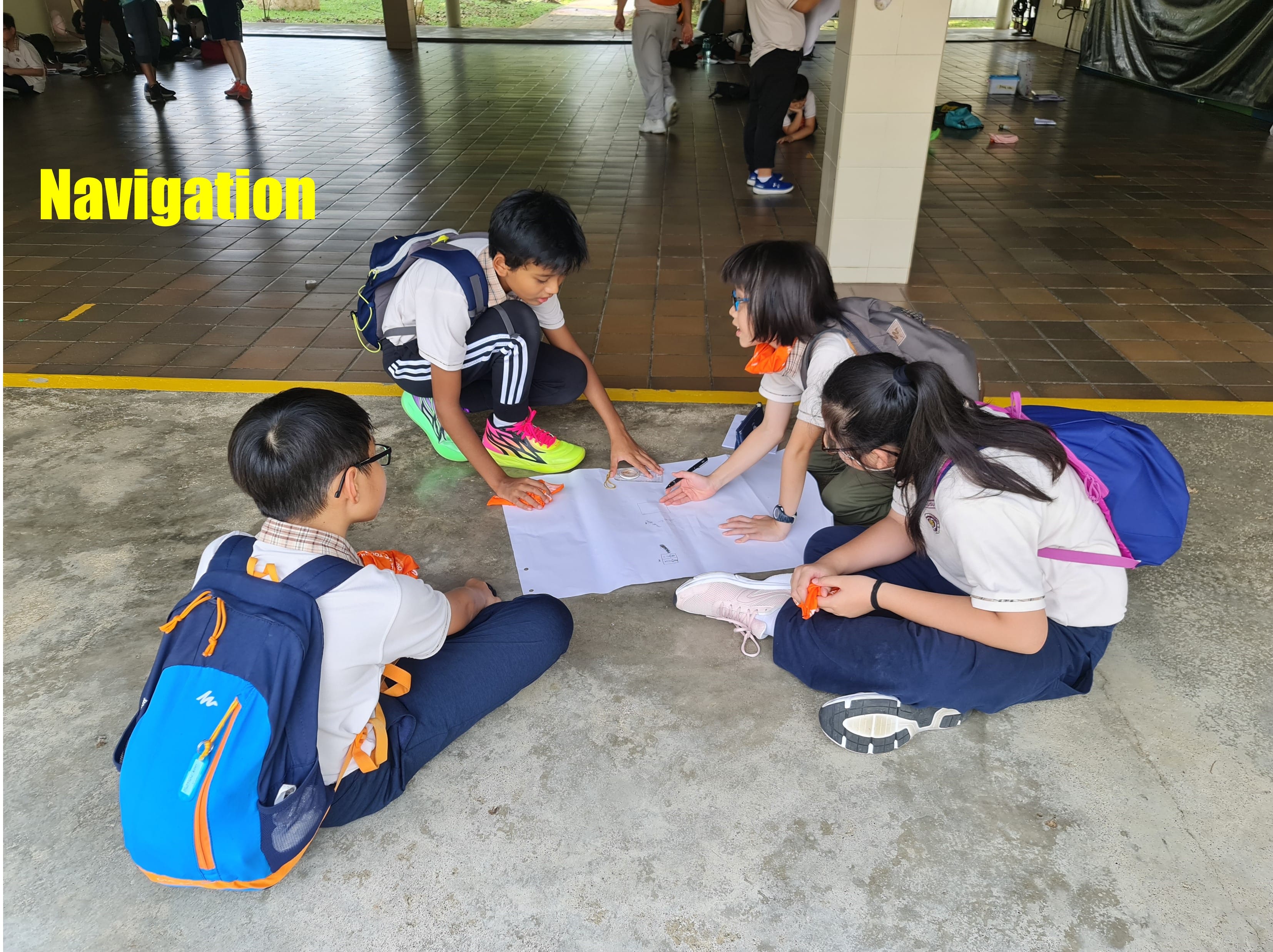 4 P5 students trying to navigate around the place